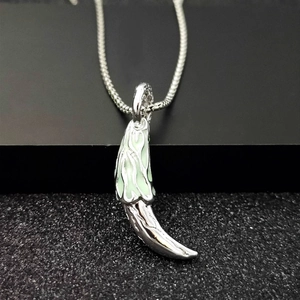 Luminous wolf tooth pendant necklace for men with green glow and silver snake chain