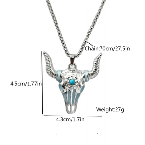 Vintage bull skull necklace with blue accents and glowing stone on silver link chain