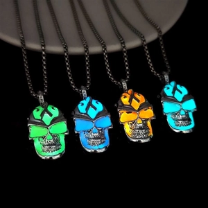 Luminous skull pendant necklace set with glowing green, blue, and orange punk pendants