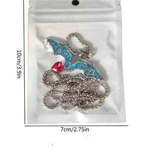 Gothic luminous bat necklace with red heart gemstone in transparent packaging
