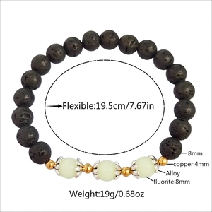 Luminous lotus lava stone bracelet with black volcano beads and glowing fluorite accents