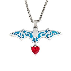 Detailed view of Gothic bat pendant with blue enamel wings and red heart crystal