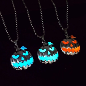 Luminous Halloween pumpkin face pendant necklaces glowing in blue and orange colors