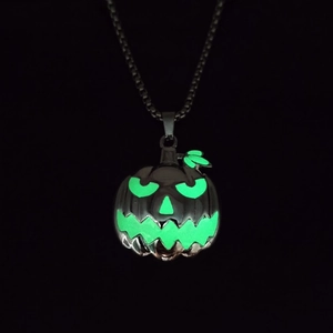 Luminous Halloween pumpkin face pendant necklace with glowing green jack-o-lantern charm