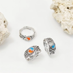Glow-in-the-dark vintage Tai Chi spinner rings with embossed wave texture and adjustable band