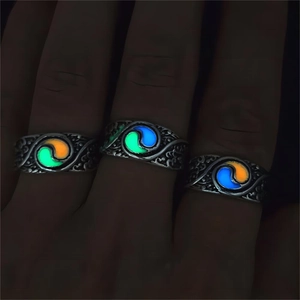Macro view of luminous vintage rings with glowing relief patterns in blue green and orange