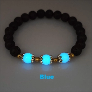 Glow-in-the-dark blue beads and black lava stone details on a lotus bracelet
