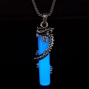 Detailed view of 3D silver dragon coiled around a blue luminous cylinder pendant