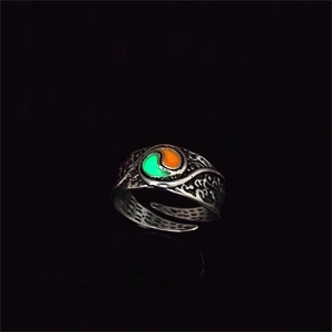 Macro shot of luminous vintage silver ring with embossed patterns and adjustable band