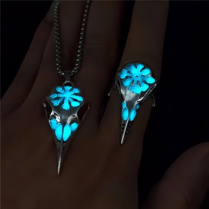 Luminous Viking bird skull ring and necklace set with glowing ice blue internal elements