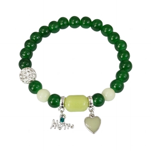 Detailed close-up of beaded bracelet with Mom charm, heart pendant and crystal accents