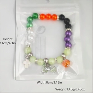 Detail view of a colorful Day of the Dead beaded bracelet with charms and size dimensions