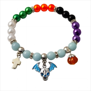 Luminous Halloween beaded bracelet with cross bat and pumpkin charms on white base