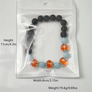 Luminous pumpkin glass beads bracelet with black volcanic stone and size dimensions detail