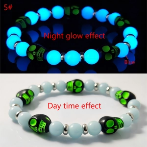 Luminous skull beaded bracelet showing blue glow in the dark and daytime natural texture
