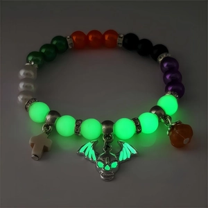 Luminous Halloween beaded bracelet with glowing bat skull, cross, and pumpkin charms