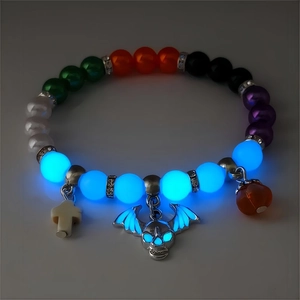 Luminous Halloween bracelet with glow-in-the-dark skull and cross charms in the dark
