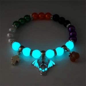 Luminous Halloween bracelet detail featuring glow-in-the-dark skull and cross beads