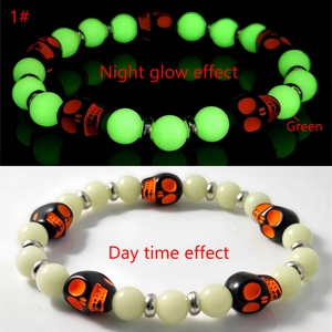 Glow in the dark Halloween skull bracelet showing daylight look and green luminous effect