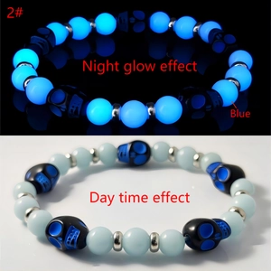 Detailed comparison of beaded skeleton bracelet showing blue night glow and daytime effects
