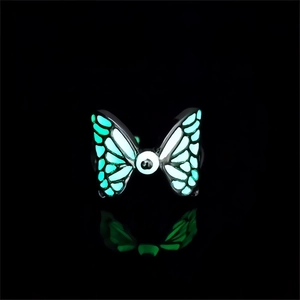 Glow in the dark butterfly ring with green fluorescent wings and hip-hop style design