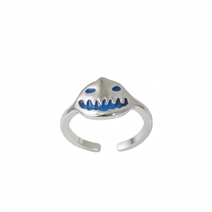 Close-up of adjustable silver pumpkin ring with blue luminous monster face details