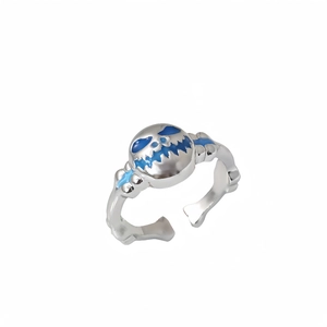 Luminous hip hop pumpkin face ring with blue glow oil drip on adjustable silver band