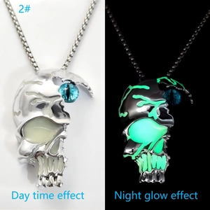 Glow-in-the-dark skull necklace showing day time effect and green night glow comparison