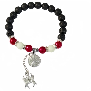 Detail of beaded bracelet with black volcanic stone, red beads and spider charms