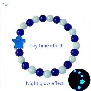 Luminous Day of the Dead glass beaded bracelet with glow-in-the-dark ghost charm detail