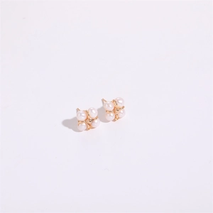 Close-up of four-petal flower earrings with 5mm white freshwater pearls and gold base