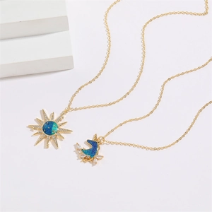 Gold celestial necklace set with sun and unicorn pendants featuring blue zircon inlay