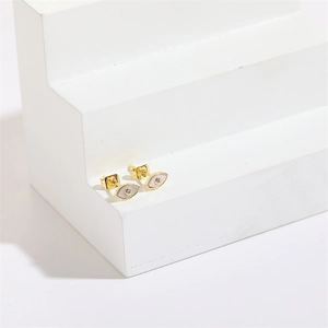 Evil eye shell zircon stud earrings with golden metal and sparkling crystal stones