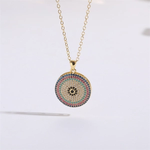 Macro shot of evil eye pendant with colorful cubic zirconia and gold-plated chain