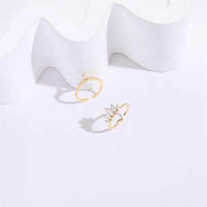 Golden crown adjustable ring with marquise zircon stones on minimalist white decor