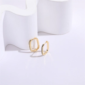 Geometric U-shaped gold earrings for women with black zircon stones in a minimalist style