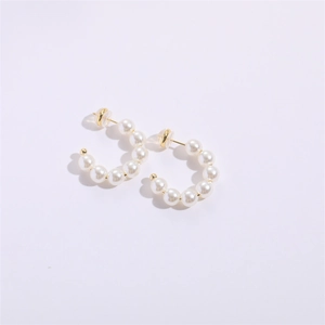 Classic C-shaped gold hoop earrings with seven round white pearls for women