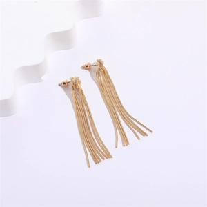 Detail view of 14K gold plated knotted stud earrings with delicate snake chain tassels