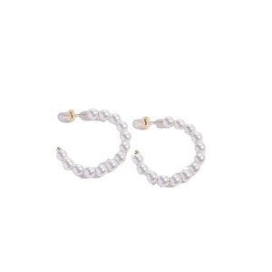 Elegant C-shaped hoop earrings featuring smooth white pearls on a polished gold frame