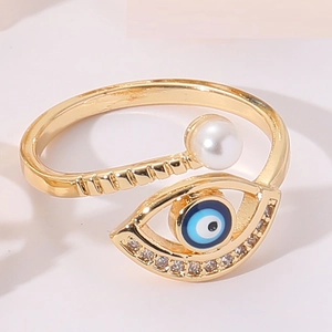 Macro detail of Evil Eye ring with blue enamel and small white zircons on golden band
