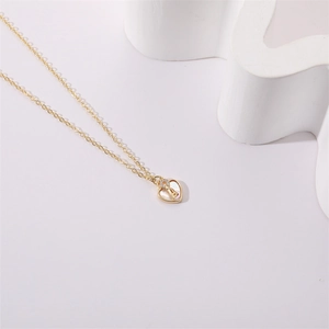 Elegant gold heart pendant necklace with letter B shell inlay and zircon accents