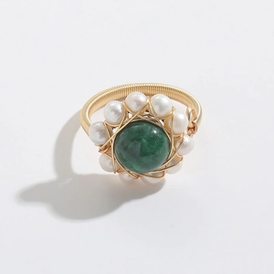 Detail of 14k gold-filled wire-wrapped ring with green agate stone and white pearls