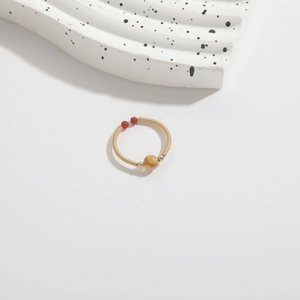Handmade 14k gold wrapped wire ring with yellow crystal and red bead accents