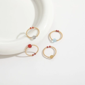 Handmade 14k gold-wrapped rings with natural gemstones including aquamarine and agate