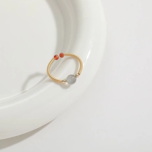 Handmade 14k gold-filled wire wrapped ring featuring natural grey and red gemstones