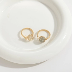 Handmade gold-wrapped wire rings with natural tourmaline and aquamarine stones