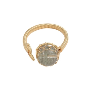 Handmade 14k gold filled wire wrapped ring featuring a natural green gemstone on white background