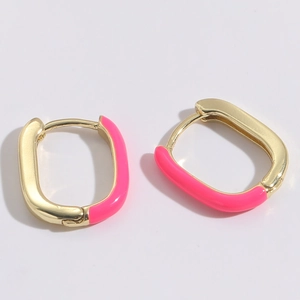 Detail of 14K gold plated U-shaped earring with bright pink enamel finish