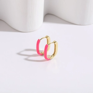 Detail showing the bright pink enamel inlay on 14K gold-plated U-shaped earrings