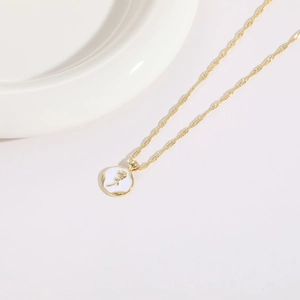 14K gold plated necklace featuring a white enamel rose coin pendant on water wave chain